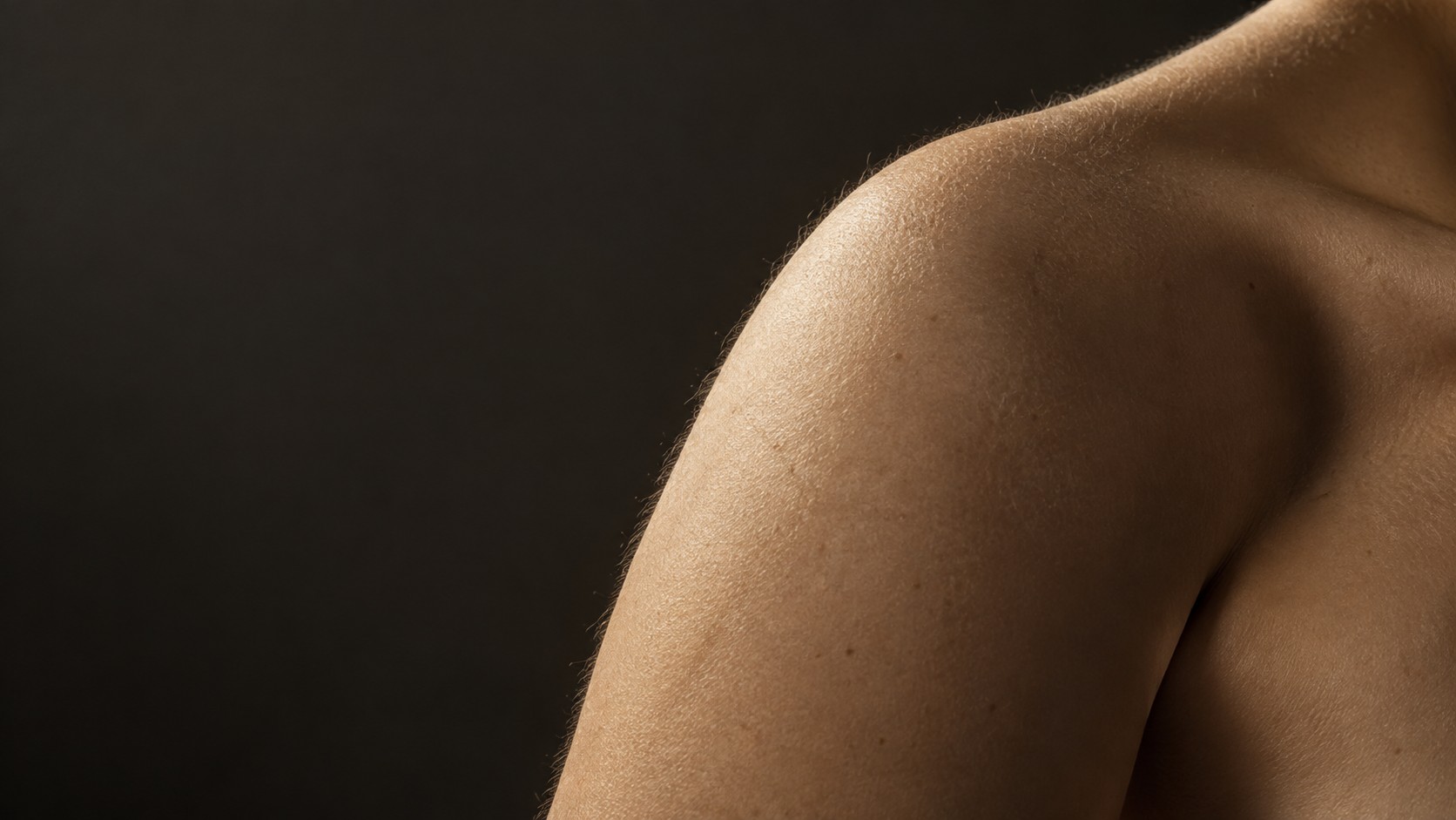 Artistic close-up of skin with warm sculptural light